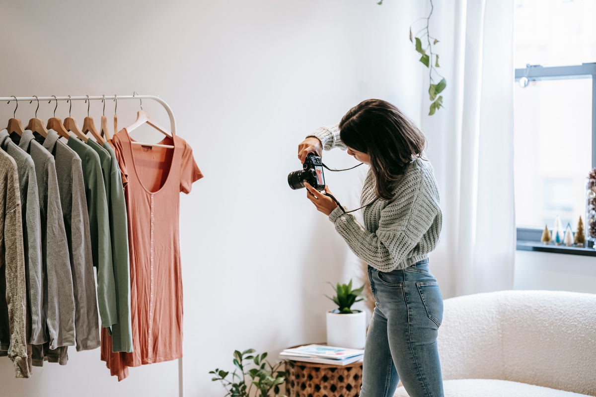 Woman taking photo of clothes